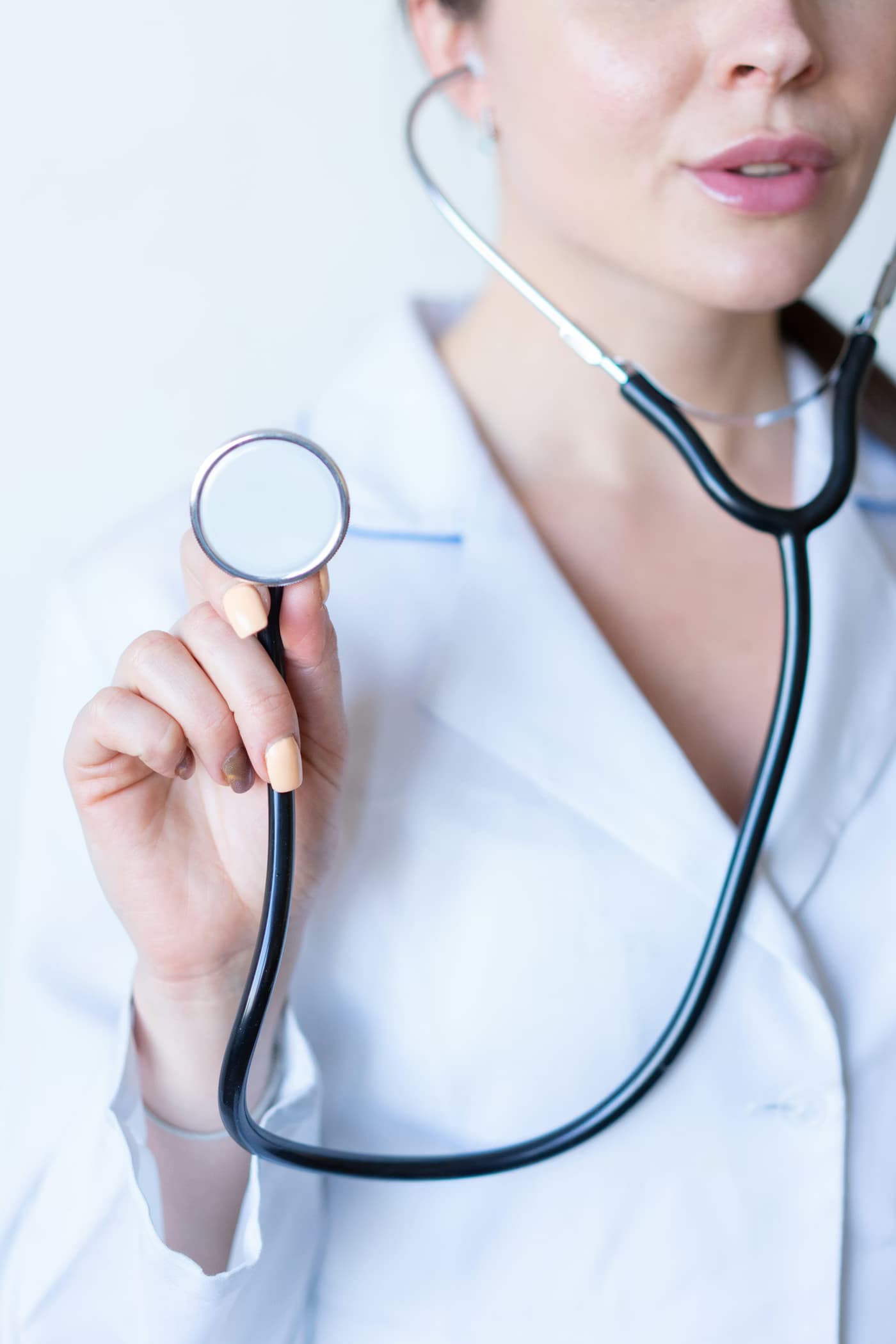 Healthcare caregiver holding a stethoscope